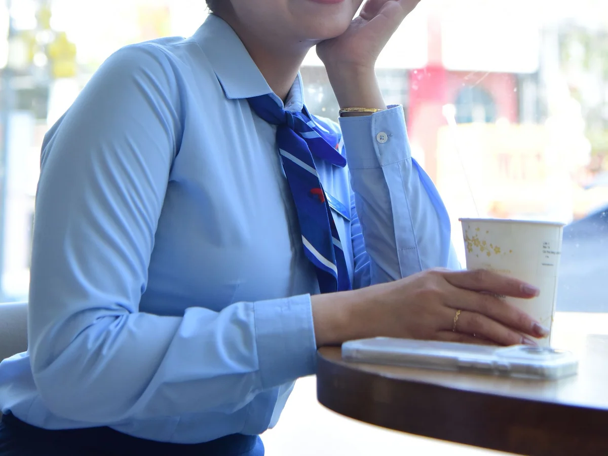 Woman taking a brief quiet reset beside an office window