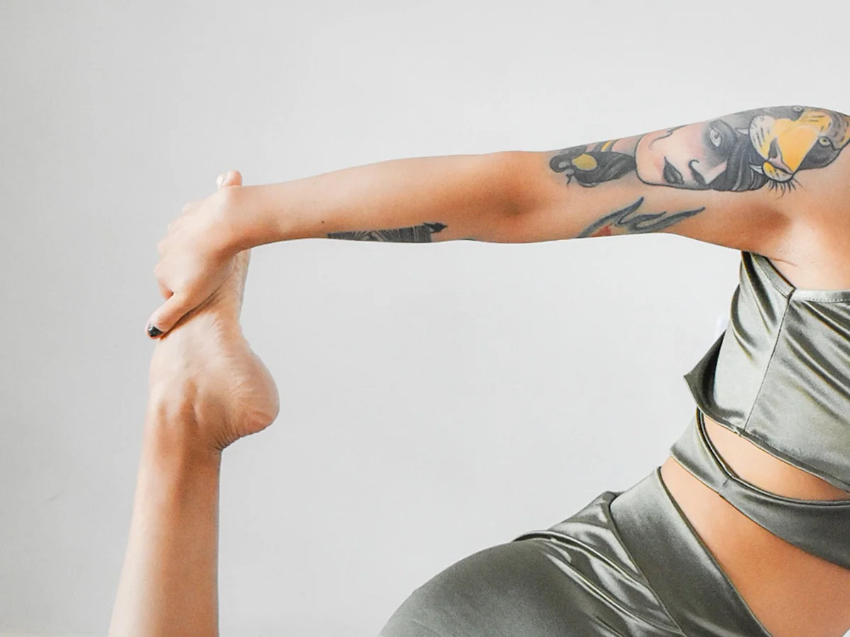 Woman strength training with compact equipment in a small apartment