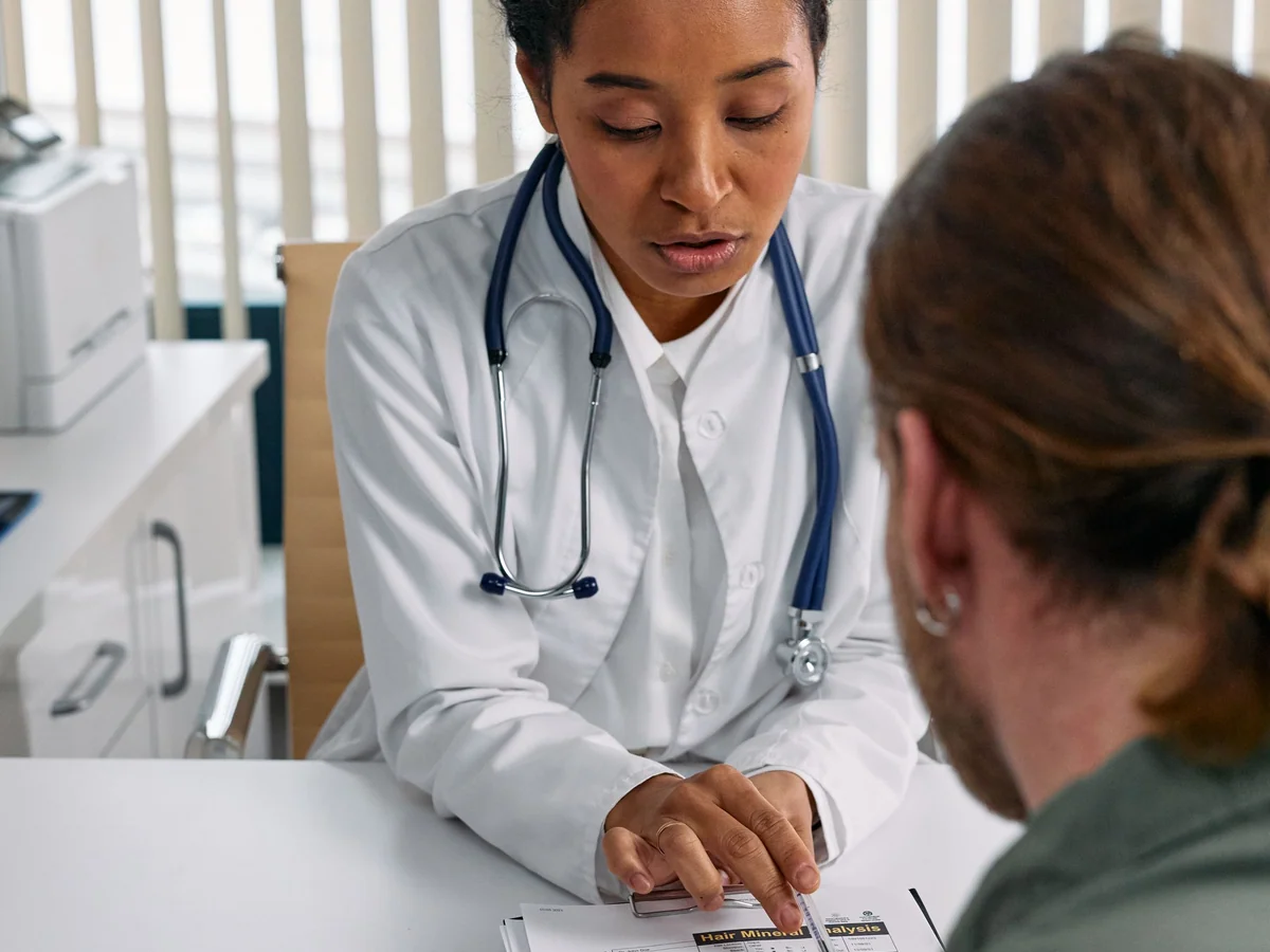Woman organizing health records and appointment notes